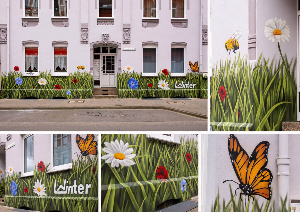 Graffiti Künstler Hannover gestaltet 20 m² Wandbild mit grüner Wiese, Blüten und Tieren in Hannover 2024